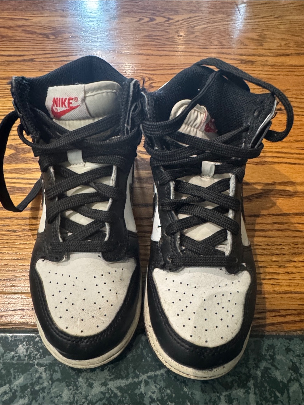 Nike Black and White Mid-Top Sneakers with Red Logo